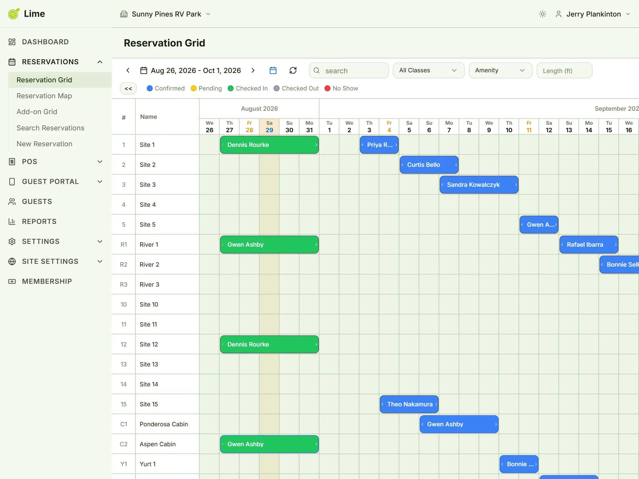 Month view of the reservation grid showing color-coded bookings across sites, cabins and yurts, with a status legend and filters